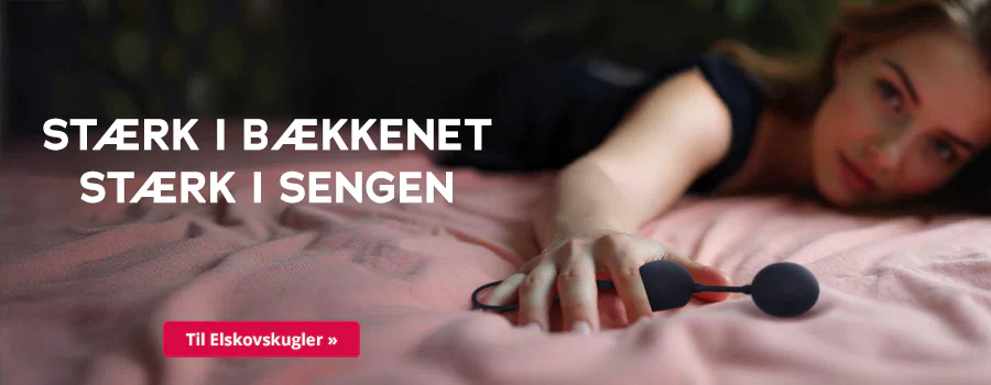 På billedet ligger en kvinde på et lyserødt lagen og strækker den ene hånd frem. Hun holder en sort kærlighedskugle i hånden. Med store hvide bogstaver står der: "STÆRK I BÆKKENET STÆRK I SENGEN". Nederst er der en rød knap med den hvide inskription: "Til kærlighedskuglerne »". Scenen er blødt oplyst med fokus på den udstrakte hånd og kærlighedskuglerne indeni.