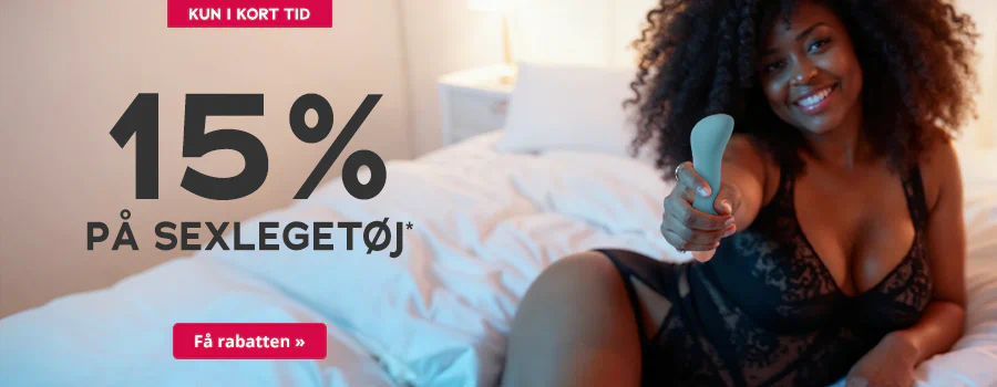 Reklamebanner med kvinde i lingeri på en seng, hun holder et sexlegetøj fremad, tekst »15 % på sexlegetøj« og en knap »Få rabatten«.