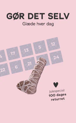 Billedet viser en reklameannonce. Øverst står der på rød baggrund »Julespecial: 100 dages returret«. Derunder står der på lyserød baggrund »Gør det selv – din fristelse for hver eneste dør«. Ved siden af er der et billede af et indpakket legetøj og en antydning af en julekalender med tal. Nederst er der en rød knap med påskriften »Fyld julekalenderen«.