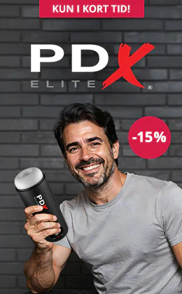 Reklamebanner for PDX Elite med 15 % rabat, mand holder en masturbator i hånden, knap »Til kampagnen«, grå baggrund, tilbud i begrænset periode.